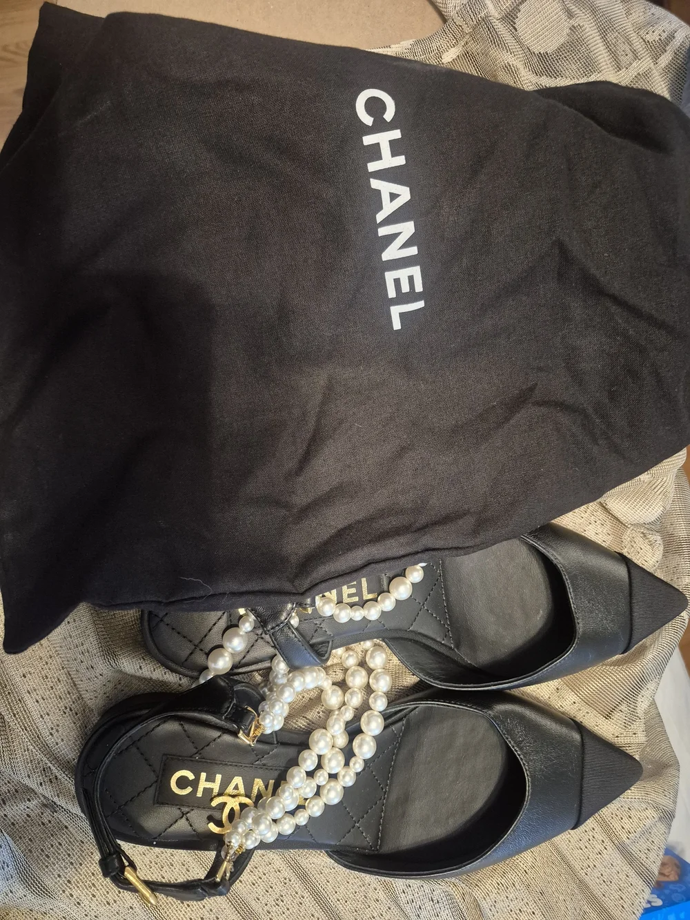 CHANEL black leather pointed-toe flats with pearls